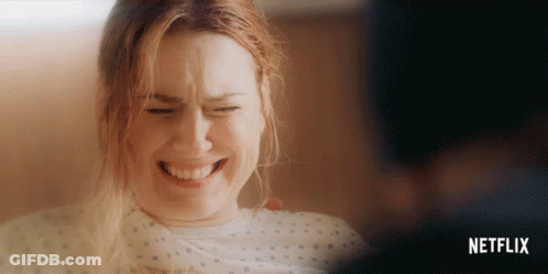 Woman In Hospital Gown With Netflix GIF