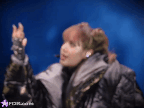Woman In Jacket And Gloves GIF