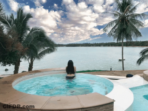 Woman In Jacuzzi Overlooking Ocean GIF