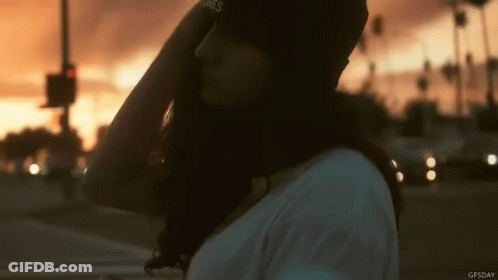 Woman In James Hat At Sunset GIF