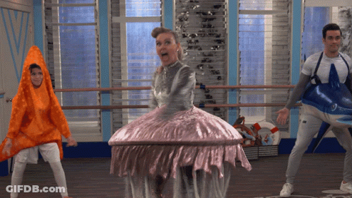 Woman In Jellyfish Costume Surrounded By People GIF