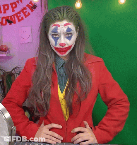 Woman In Joker Costume In Front Of Green Screen GIF