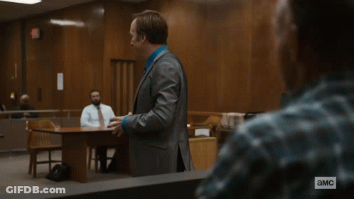Woman In Judge Robe At Desk With Equity Seal GIF