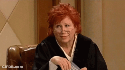 Woman In Judge Robe Holding Paper GIF