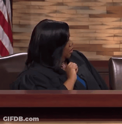 Woman In Judge's Robe At Desk GIF