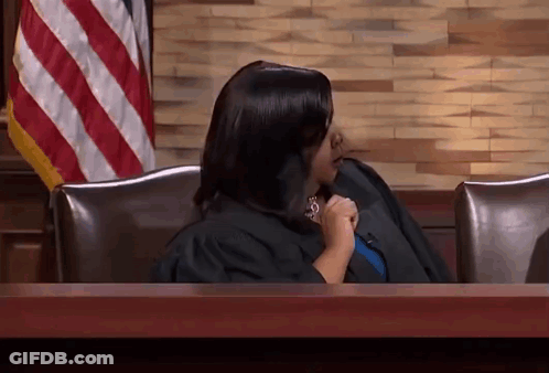 Woman In Judge's Robe At Desk GIF