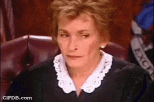 Woman In Judge's Robe Making Funny Face GIF