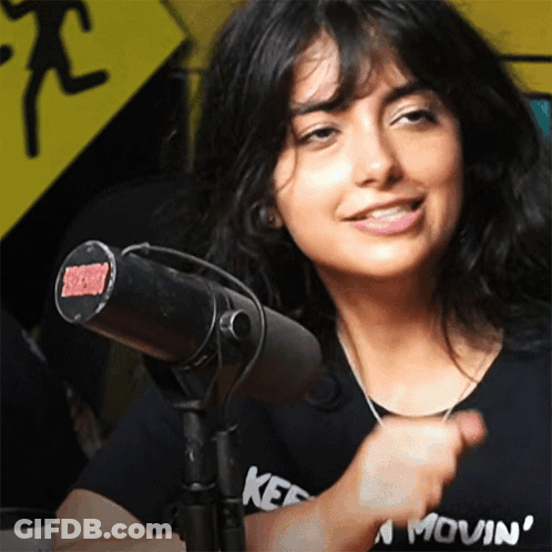 Woman In Kef Shirt At Microphone GIF