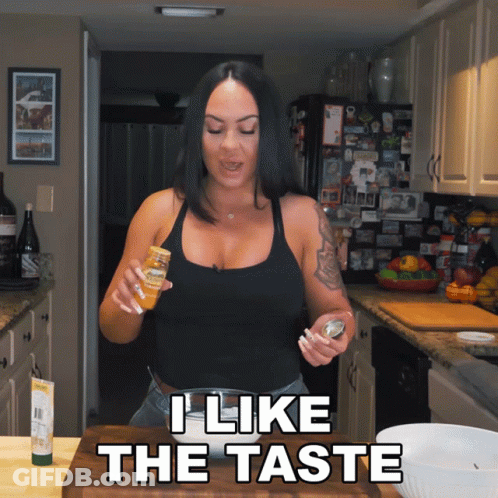 Woman In Kitchen Saying I Like The Taste GIF