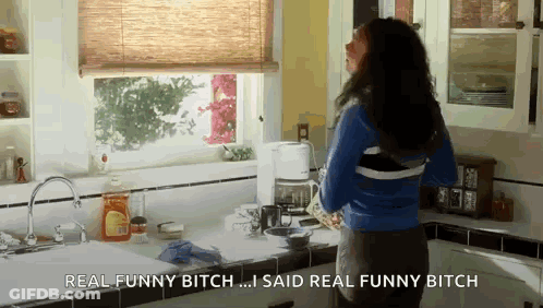 Woman In Kitchen Saying Real Funny Bitch GIF