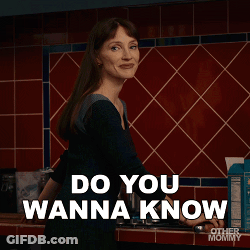 Woman In Kitchen Saying Something Silly GIF