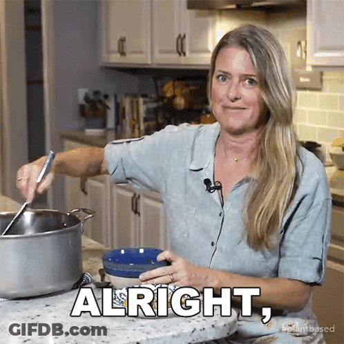 Woman In Kitchen With Alright On Counter GIF