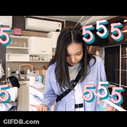Woman In Kitchen With Number 555 GIF