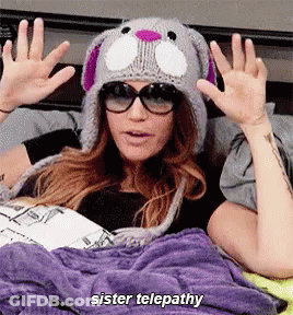 Woman In Knitted Hat Sunglasses Says Sister Telepathy GIF