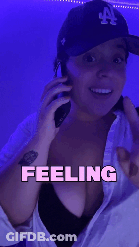 Woman In LA Hat Talking On Phone GIF