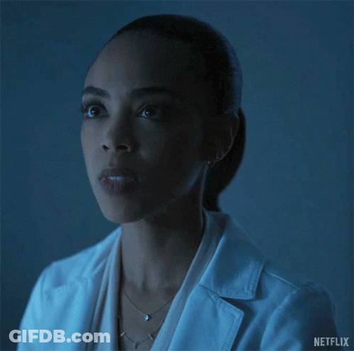 Woman In Lab Coat Blowing Kiss GIF