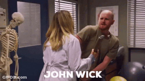 Woman In Lab Coat Holding Man's Arm With Skeleton Background GIF
