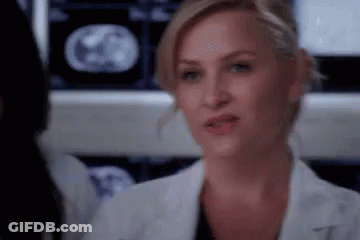 Woman In Lab Coat Looking At MRI Scan GIF