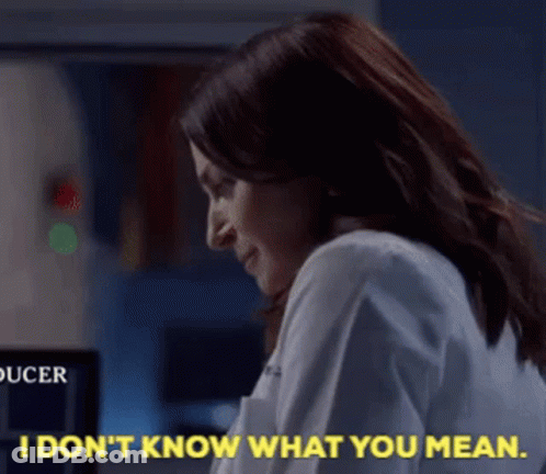 Woman In Lab Coat Saying I Don't Know What You Mean GIF