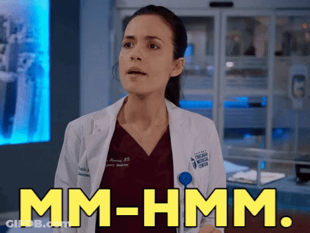 Woman In Lab Coat Saying Mm-Hmm GIF