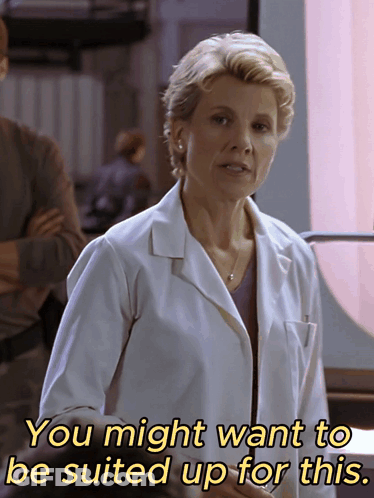 Woman In Lab Coat Saying You Might Want To Be Suited Up For This GIF
