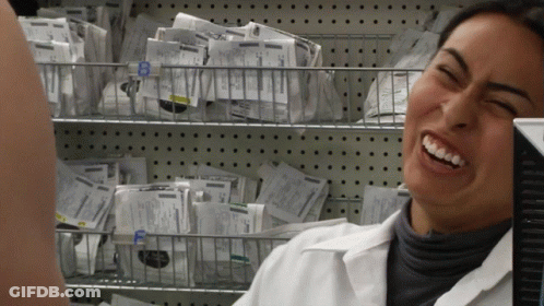 Woman In Lab Coat Smiling Beside Basket Labeled B GIF