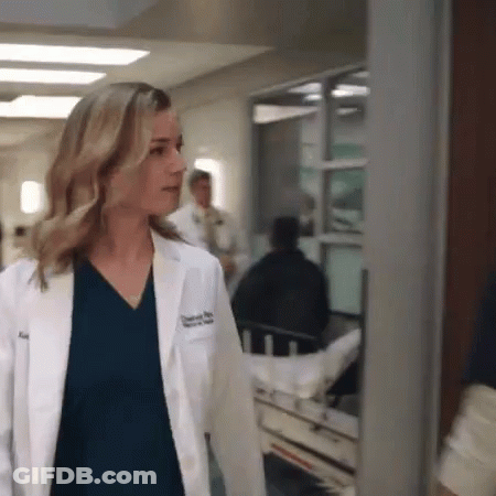 Woman In Lab Coat Walking Beside Stretcher GIF