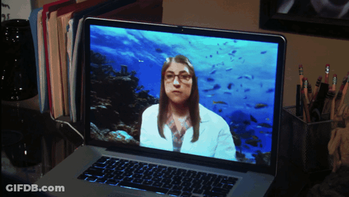 Woman In Lab Coat With Glasses On Laptop Screen GIF