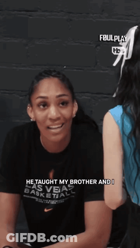 Woman In Las Vegas Basketball Shirt Talking To Another GIF