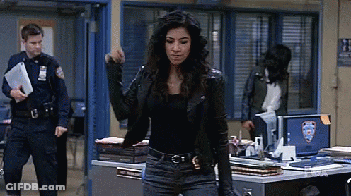 Woman In Leather Jacket Facing Police Officer GIF