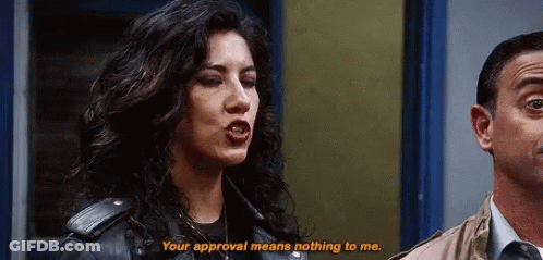 Woman In Leather Jacket Next To Man In Suit GIF