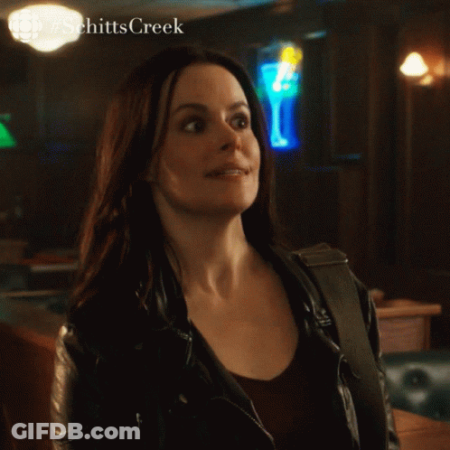 Woman In Leather Jacket Saying Yeah In Bar GIF