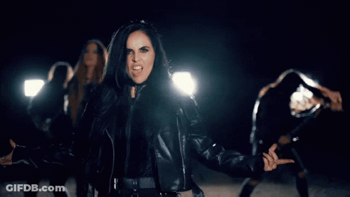 Woman In Leather Jacket Sticking Out Tongue GIF