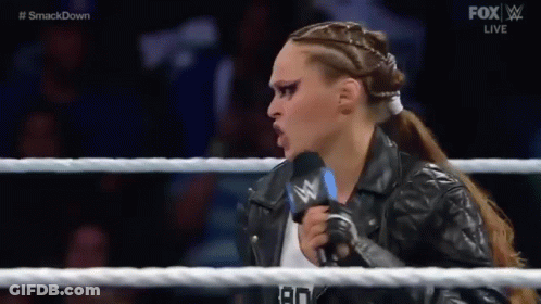 Woman In Leather Jacket Talking Into Microphone GIF