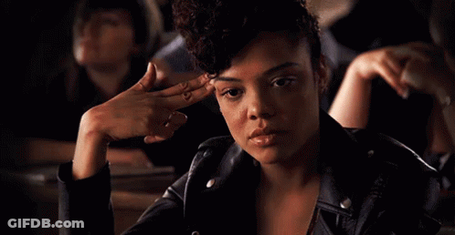 Woman In Leather Jacket With Finger On Forehead GIF