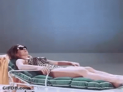 Woman In Leopard Bikini Lying GIF