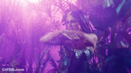 Woman In Leopard Dress Dancing In Rain GIF