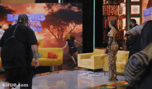 Woman In Leopard Print Dress Sign Saying Babies GIF