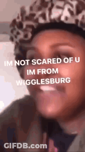 Woman In Leopard Print Hat Making Funny Face GIF