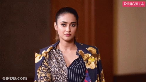 Woman In Leopard Print Jacket And Striped Shirt GIF
