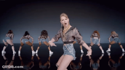 Woman In Leopard Print Jacket Dancing With Dancers GIF