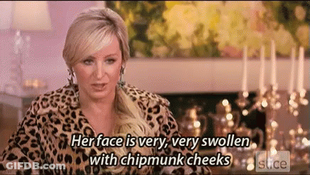 Woman In Leopard Print Jacket With Swollen Chipmunk Cheeks GIF
