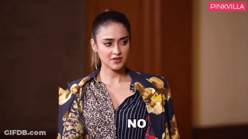 Woman In Leopard Print Shirt And Blue Jacket Saying No GIF