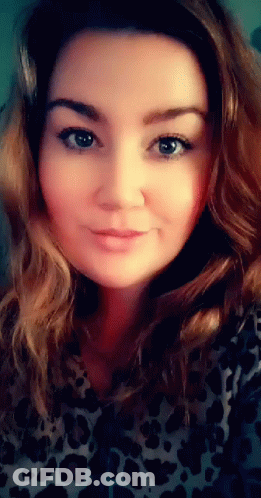 Woman In Leopard Print Shirt Close Up GIF