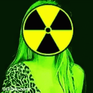 Woman In Leopard Print Shirt With Radioactive Symbol On Face GIF
