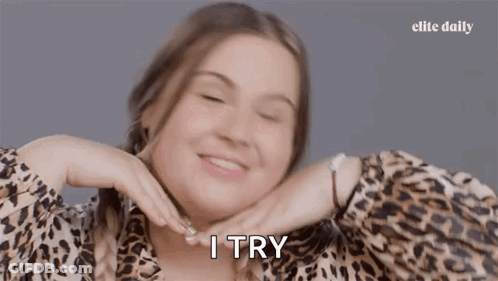 Woman In Leopard Print Smiling I Try GIF
