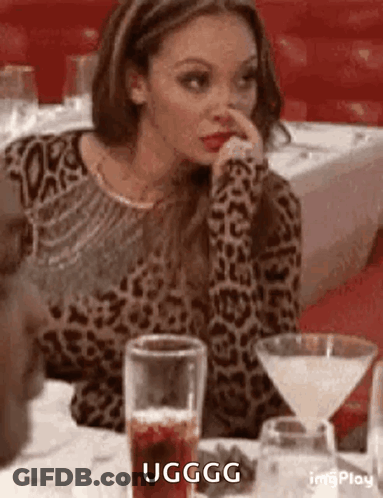 Woman In Leopard Print Sweater With Martini Glass And Drink GIF