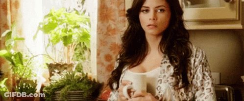 Woman In Leopard Robe Holding Coffee GIF