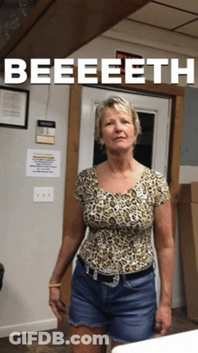 Woman In Leopard Shirt Standing In Front Of Door Saying Beeeeeth GIF