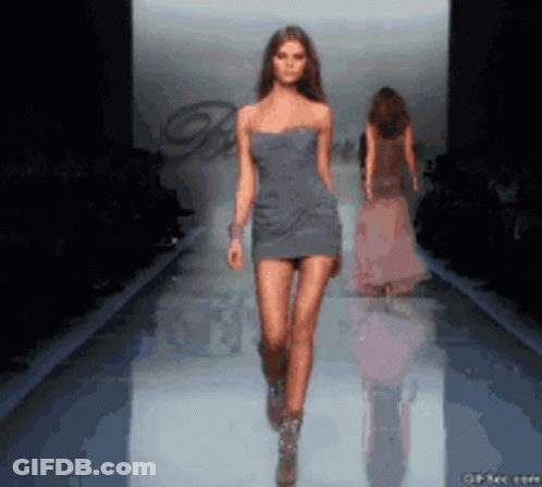 Woman In Light Blue Hoodie Looking Over Shoulder GIF